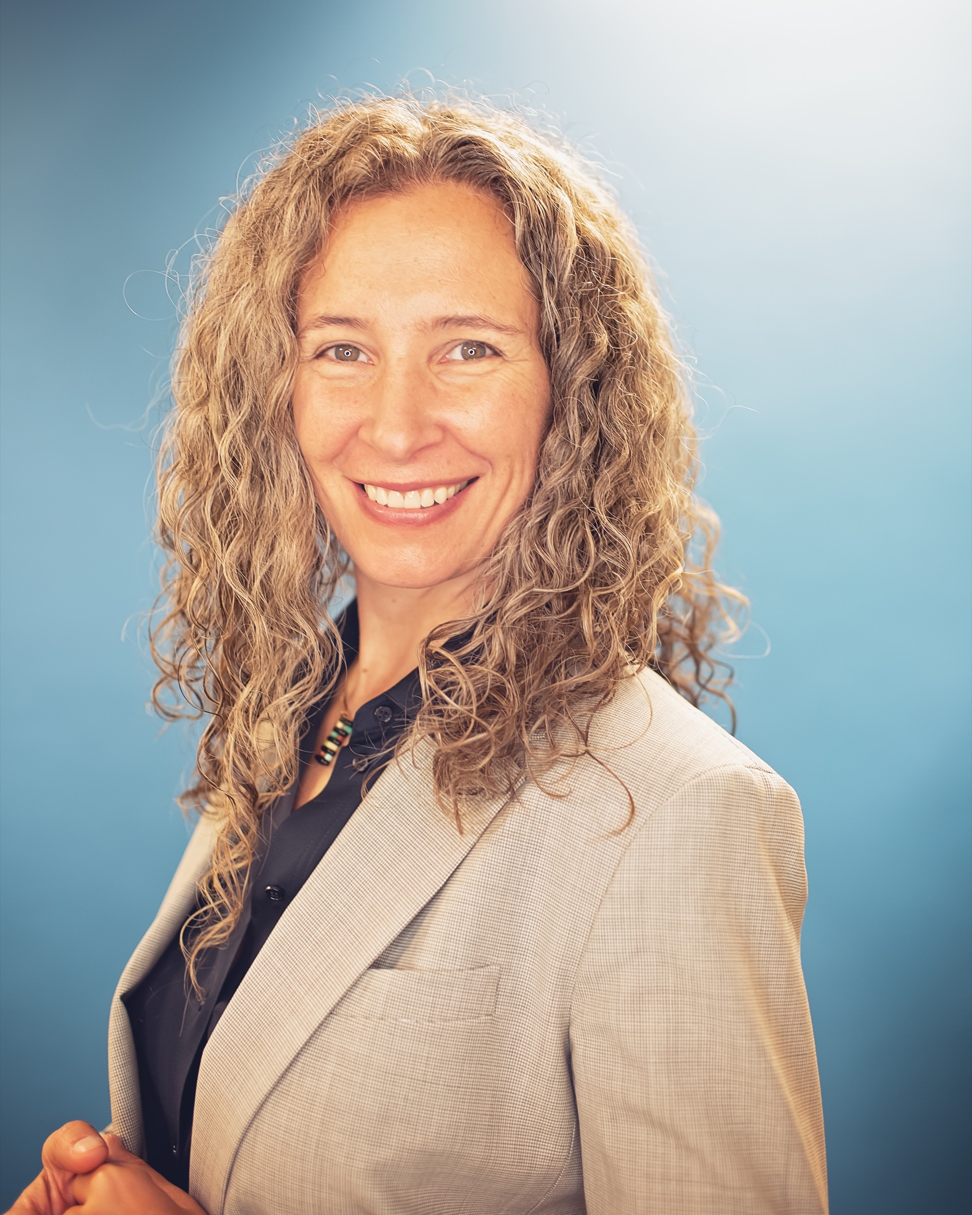 Erika Flint smiling in a professional headshot